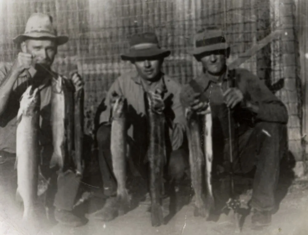 Gen, Bud, and Frank Ernst (far right) with one day’s catch from Nacimento River at Big Hole where dam is now, 1943.